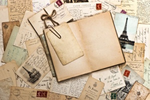 old papers, french post cards and open diary book